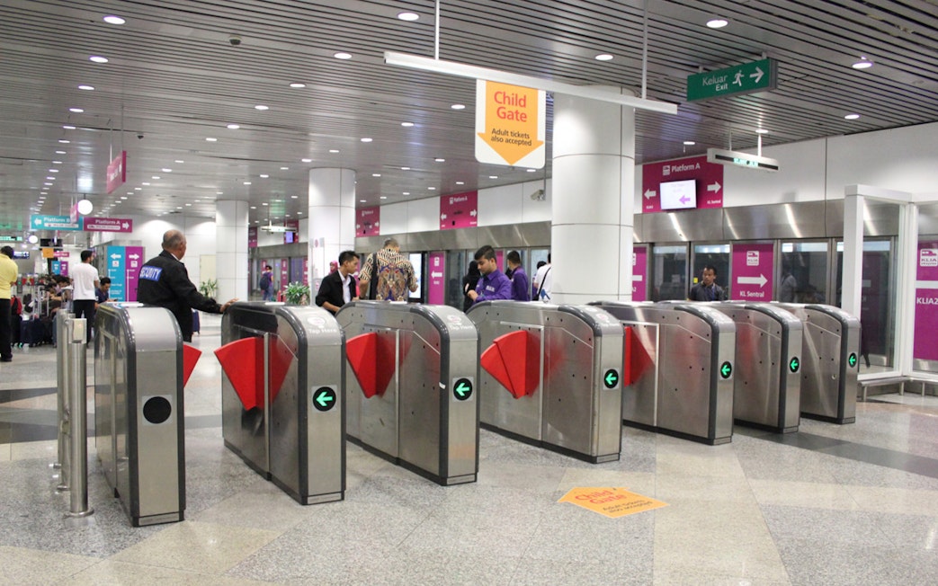 KLIA Express ticket gates at Kuala Lumpur station, Malaysia.