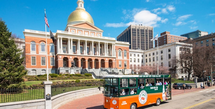 Boston Old Town Trolley passing Massachusetts State House.