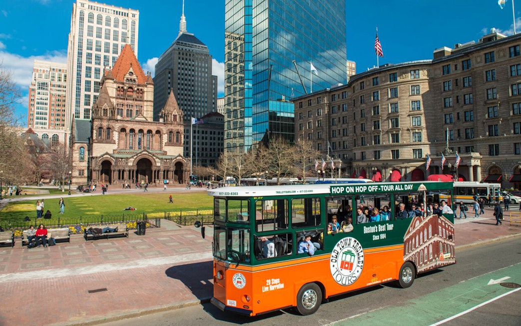 Boston Old Town Trolley passing Trinity Church in Copley Square.