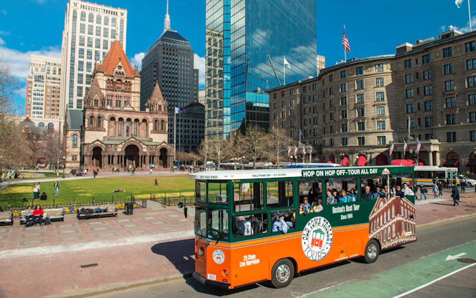 Boston Old Town Trolley passing Trinity Church in Copley Square.