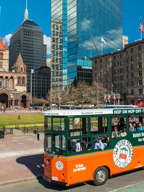 Boston Old Town Trolley passing Trinity Church in Copley Square.
