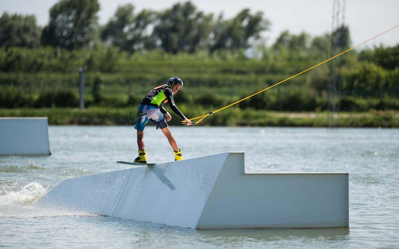 Wakeboarder on obstacle at Starwake Cable Park.