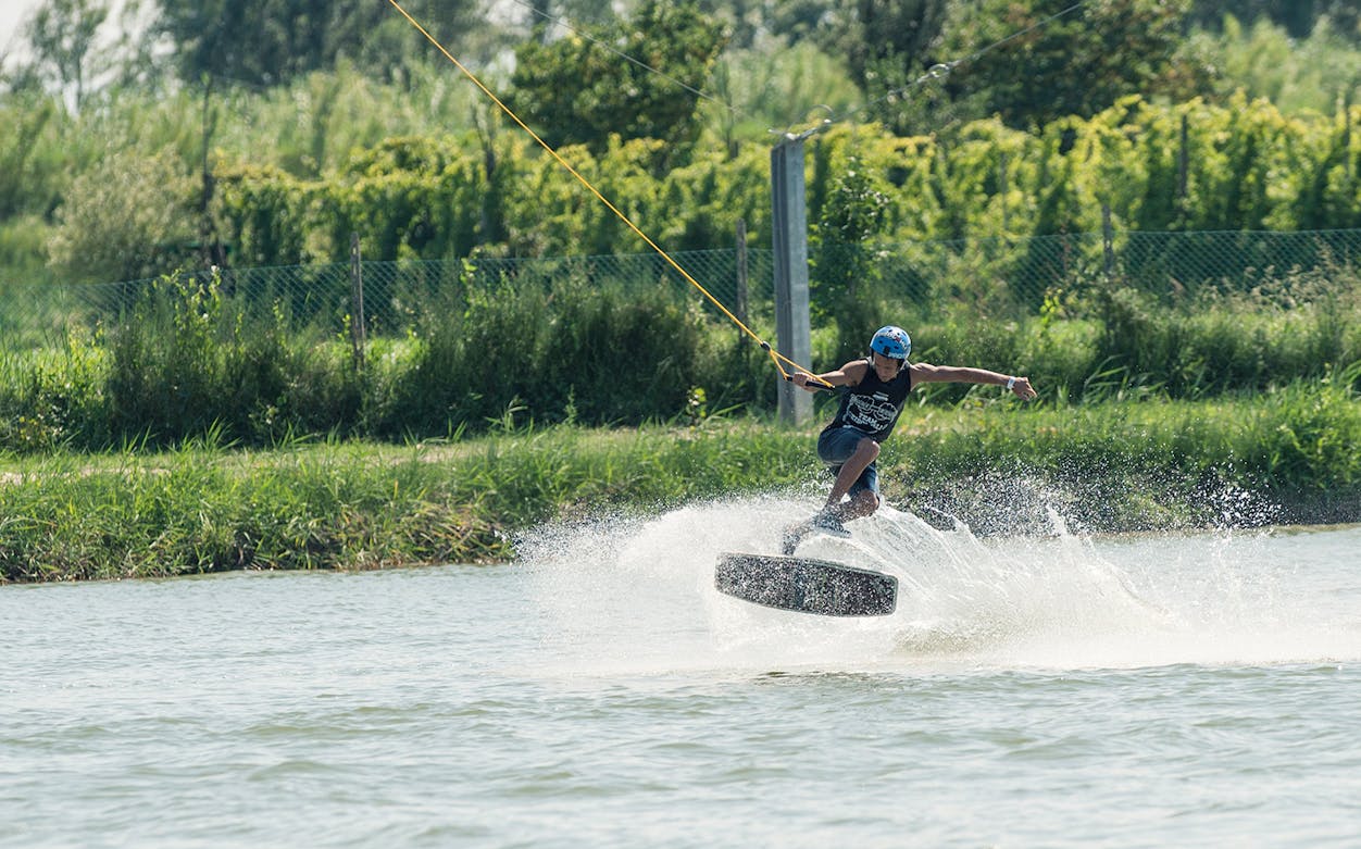 Wakeboarder performing a jump at Starwake Cable Park.