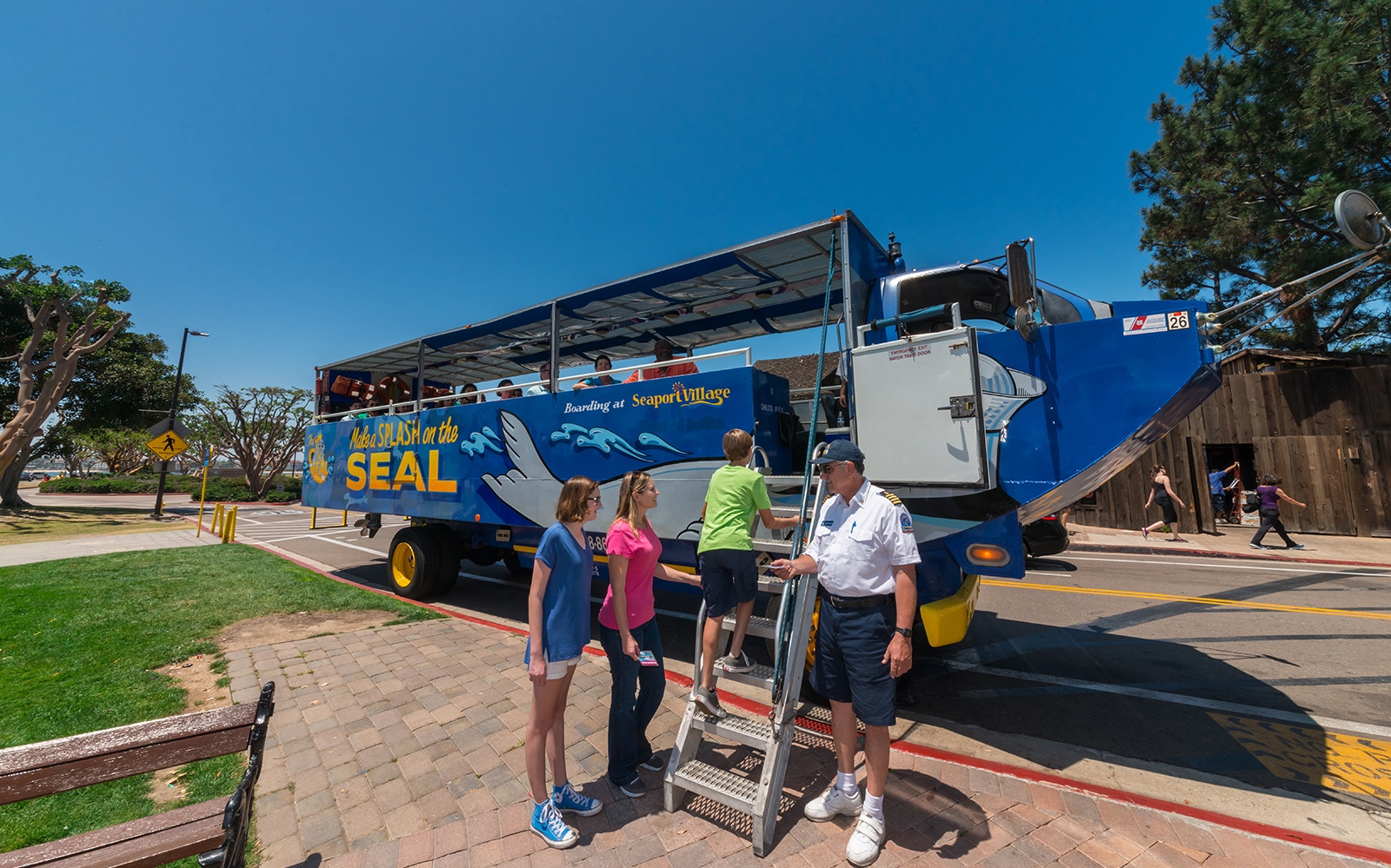 Visitors boarding the San Diego SEAL Tour vehicle at Seaport Village.