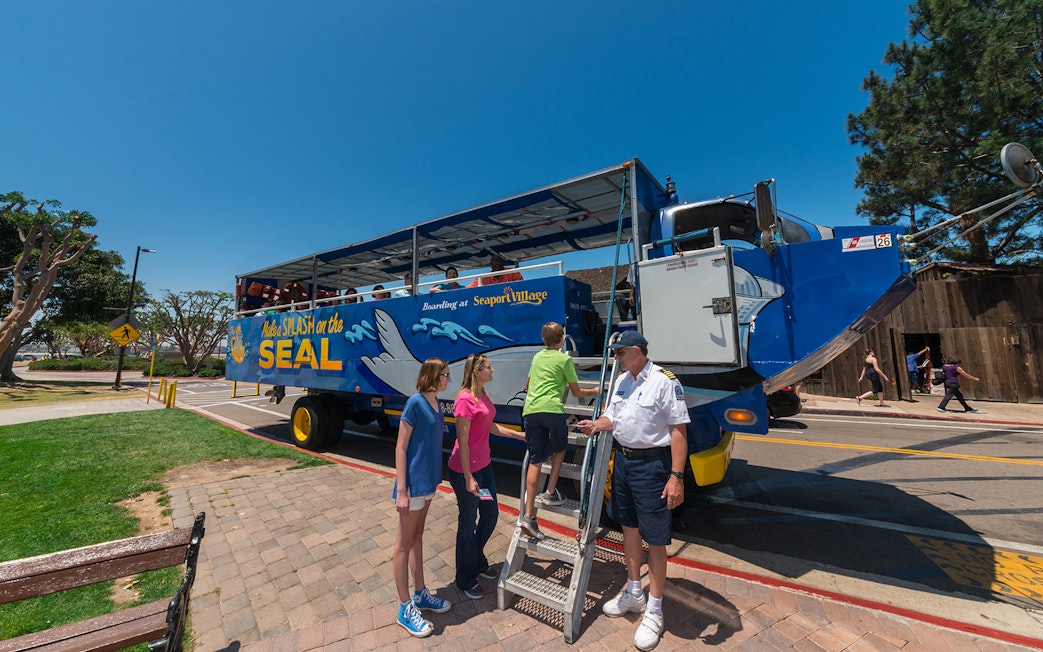 Visitors boarding the San Diego SEAL Tour vehicle at Seaport Village.