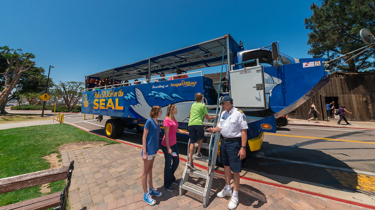 Visitors boarding the San Diego SEAL Tour vehicle at Seaport Village.