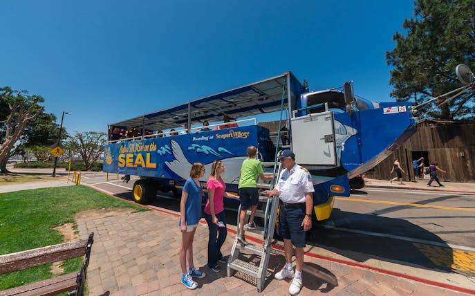 Visitors boarding the San Diego SEAL Tour vehicle at Seaport Village.