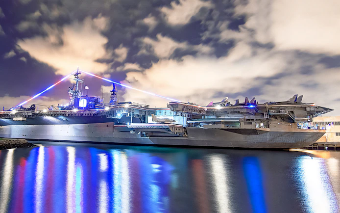 USS Midway Museum illuminated at night, San Diego City Lights Night Tour.