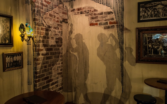 Jazz musician silhouettes on a brick wall at American Prohibition Museum.