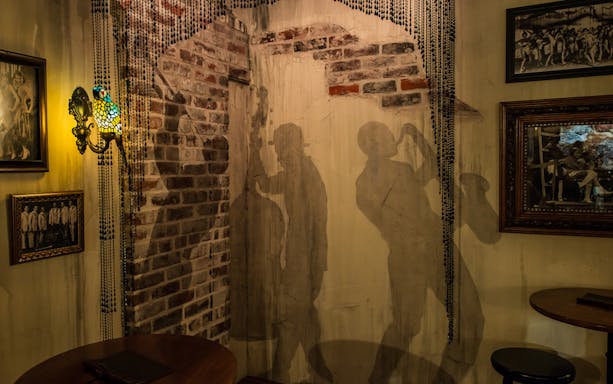 Jazz musician silhouettes on a brick wall at American Prohibition Museum.