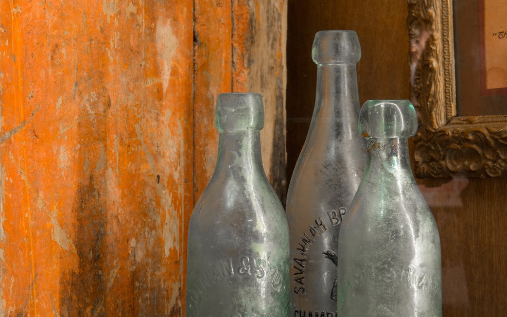 Vintage glass bottles at American Prohibition Museum in Savannah.
