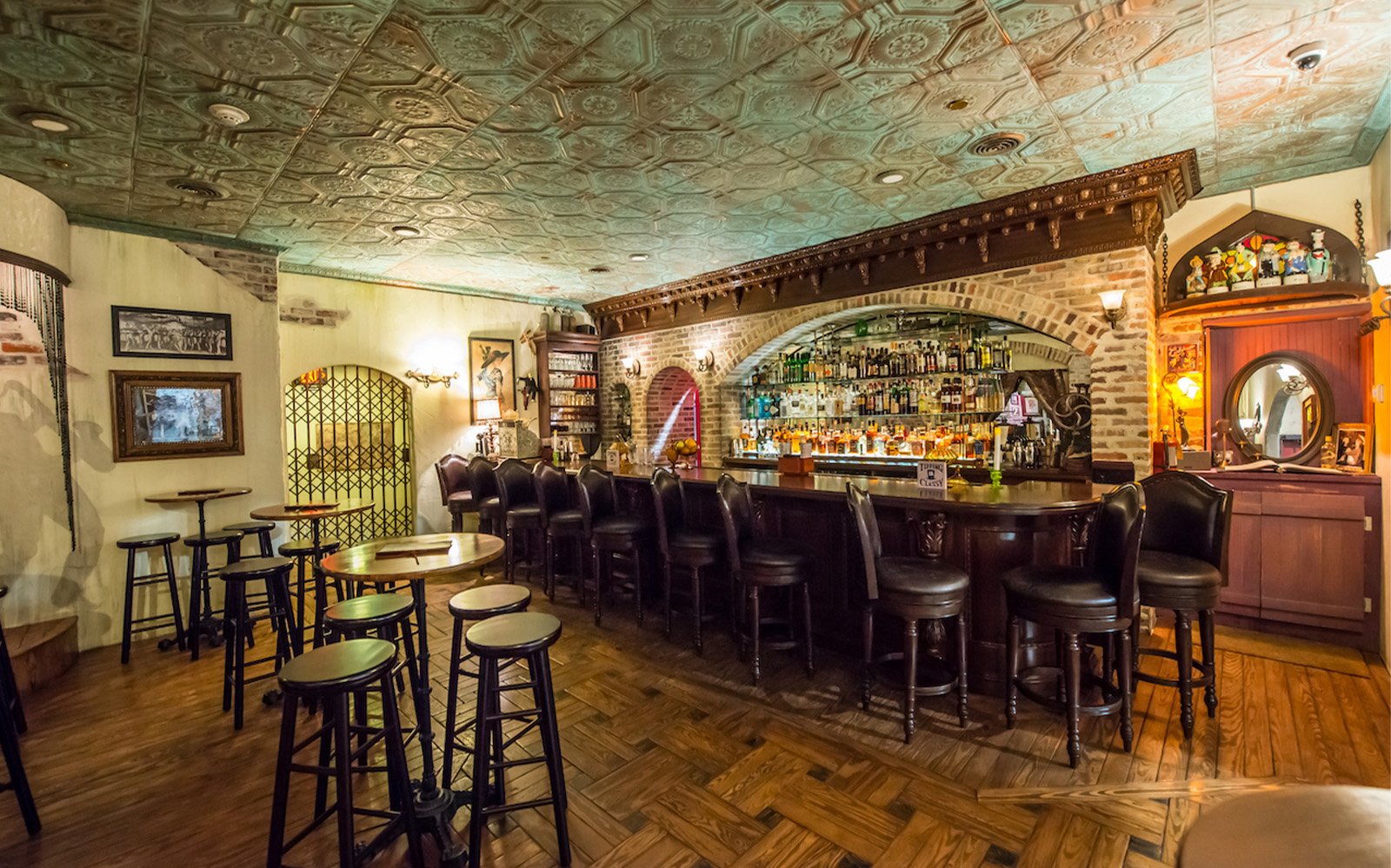 Bar area inside American Prohibition Museum with vintage decor and seating.