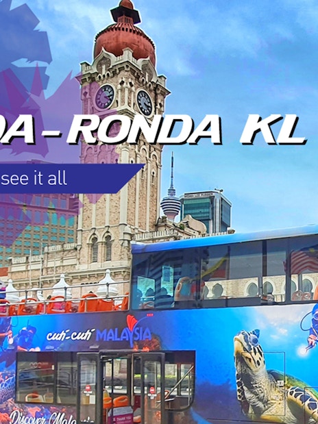 KL Hop-on Hop-off bus in front of Sultan Abdul Samad Building, Kuala Lumpur.