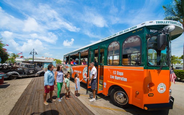 Key West Old Town Trolley with tourists boarding for a narrated tour.