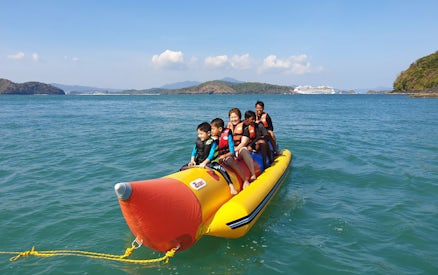 Banana boat ride with tourists near Intan Kecil Island, Langkawi.