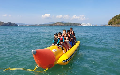 Banana boat ride with tourists near Intan Kecil Island, Langkawi.