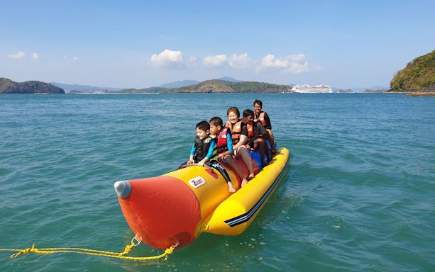 Banana boat ride with tourists near Intan Kecil Island, Langkawi.