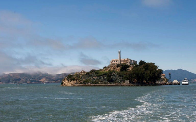 Alcatraz Island view from the water, San Francisco Bay, part of Muir Woods, Sausalito & Escape from the Rock tour.