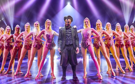 Performer and dancers on stage at ARISE Grand Show, Berlin.
