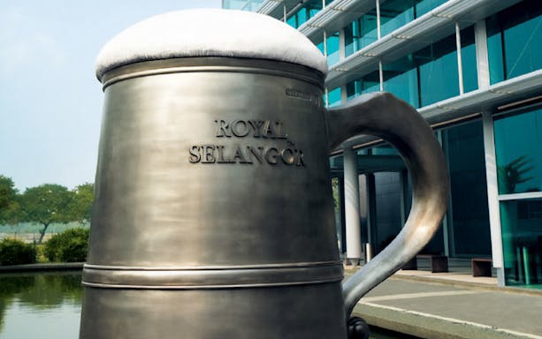 Royal Selangor pewter mug sculpture at Kuala Lumpur visitor center.