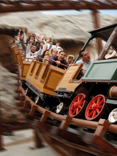 Train model ride with passengers at Gardaland Park.