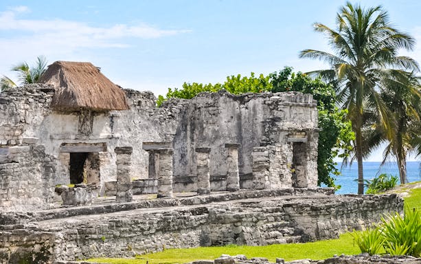 Ancient Mayan ruins in Tulum with ocean view, part of 4x1 Tulum, Cobá, Buffet Lunch & Cenote tour.
