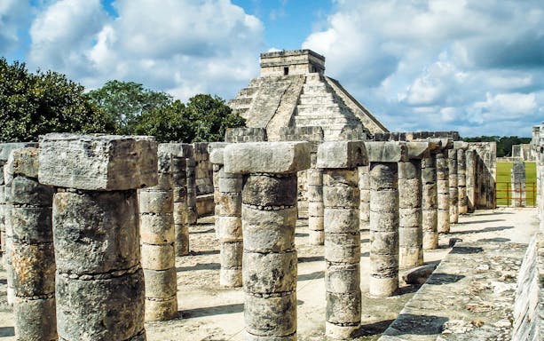 Stone columns and El Castillo pyramid at Chichén Itzá, Mexico.