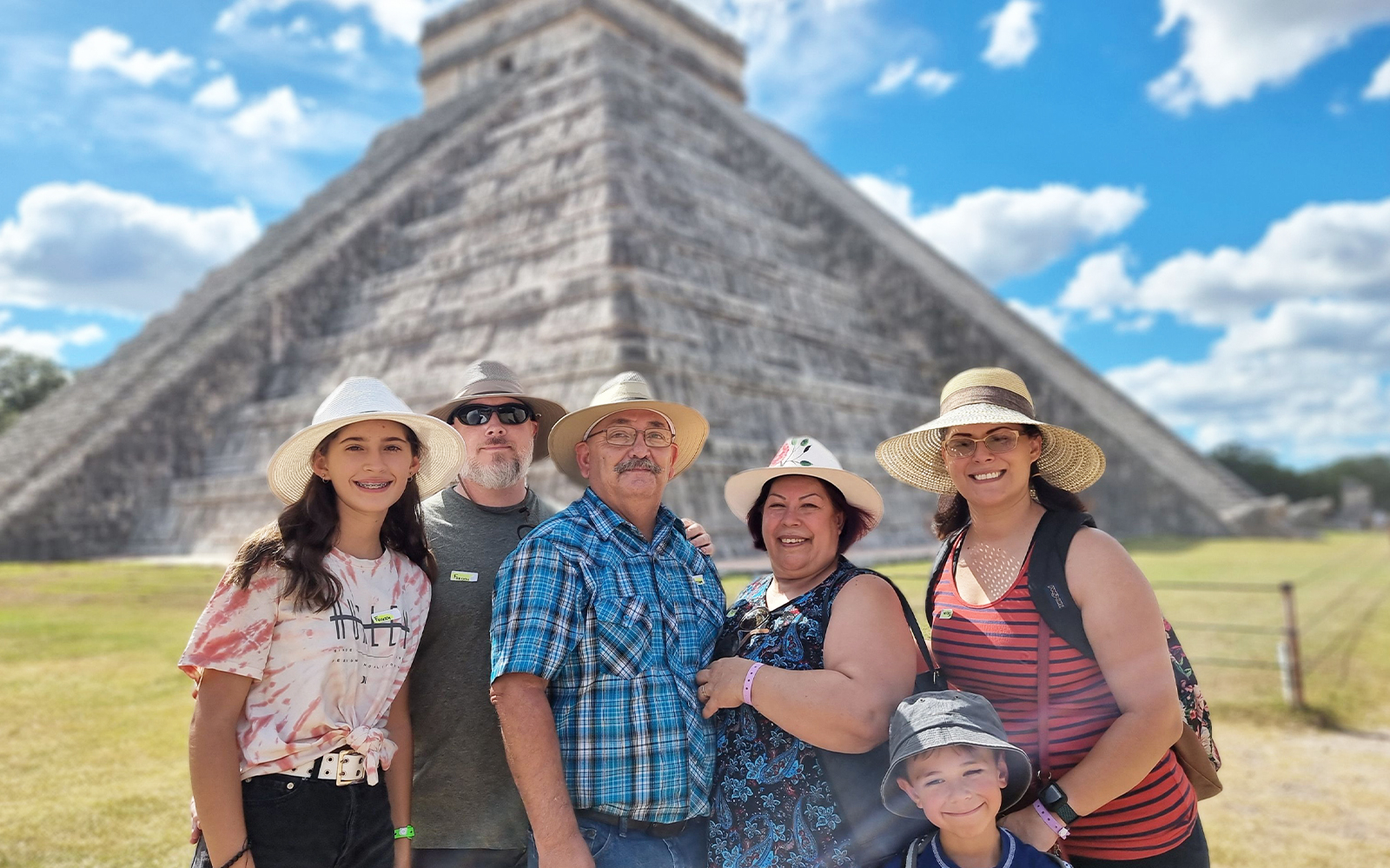 Group of tourists in front of the Pyramid of Kukulcán at Chichén Itzá, Mexico.
