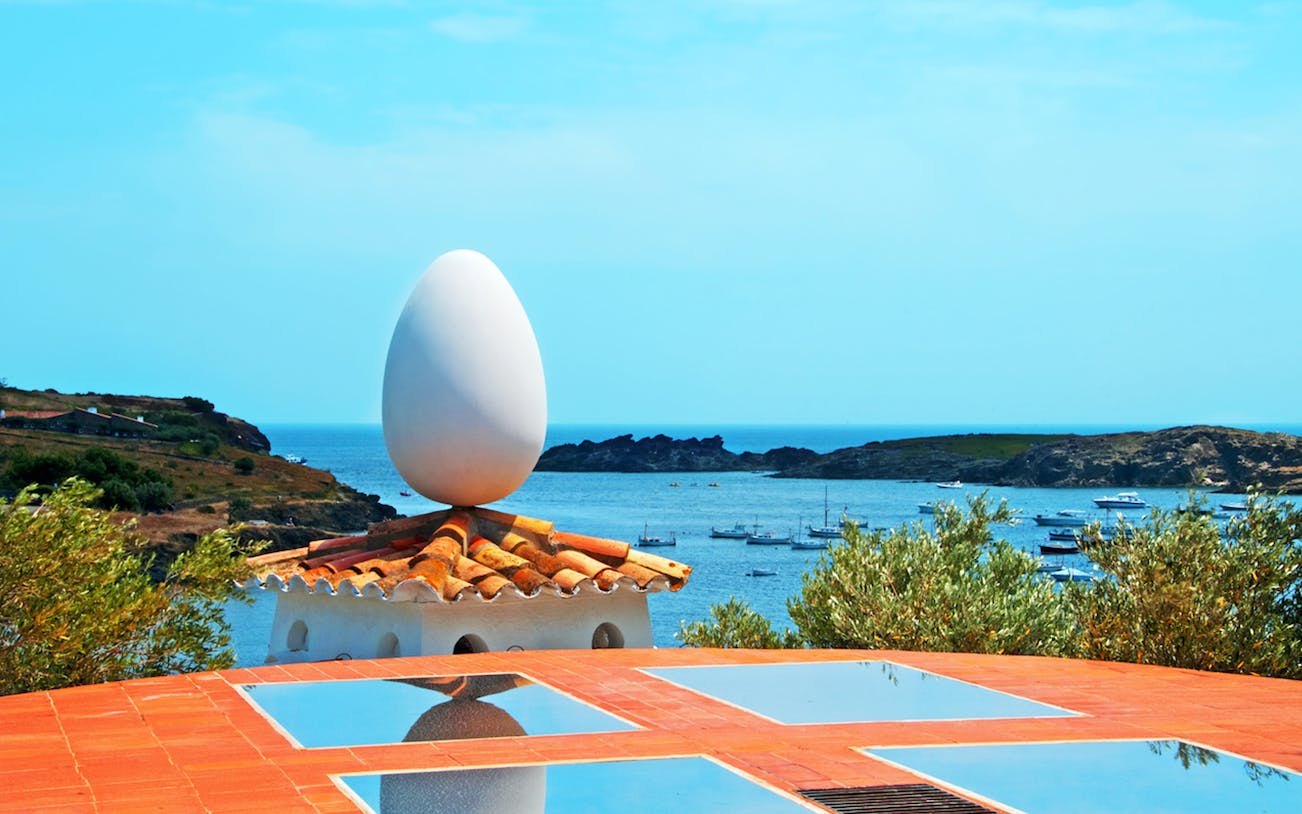 Rooftop egg sculpture at Dalí House overlooking Cadaqués bay.