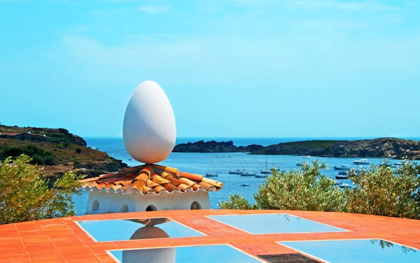 Rooftop egg sculpture at Dalí House overlooking Cadaqués bay.