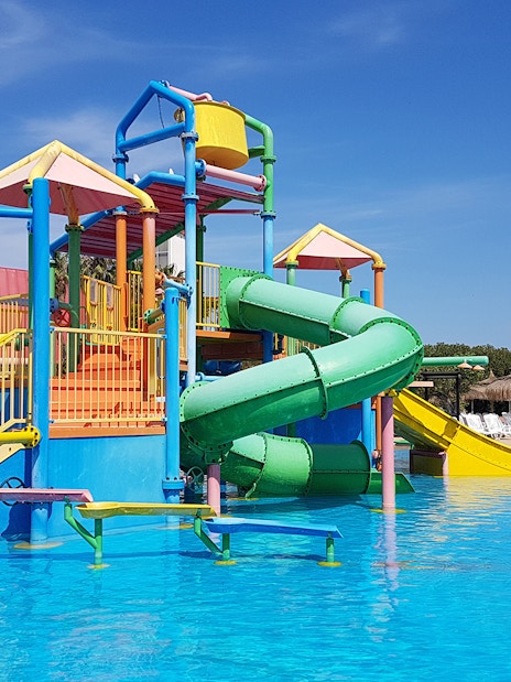 Colorful water play structure with slides at Aquopolis Costa Daurada.