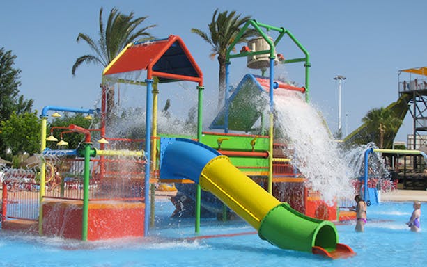 Colorful water playground with slides and fountains at Aquopolis Torrevieja.
