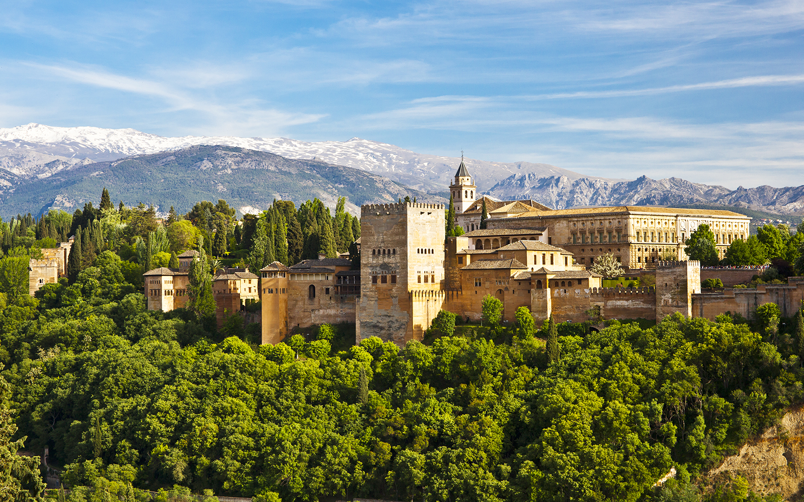 Alhambra palace complex with Sierra Nevada mountains in Granada, Spain.