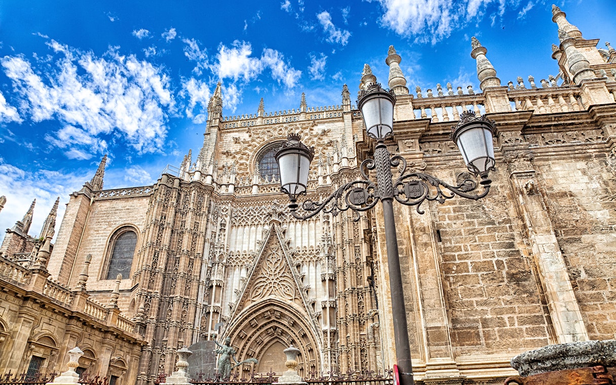 Cathedral and Royal Chapel of Granada facade with ornate Gothic architecture.