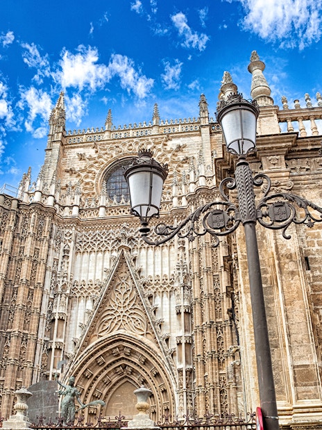 Cathedral and Royal Chapel of Granada facade with ornate Gothic architecture.