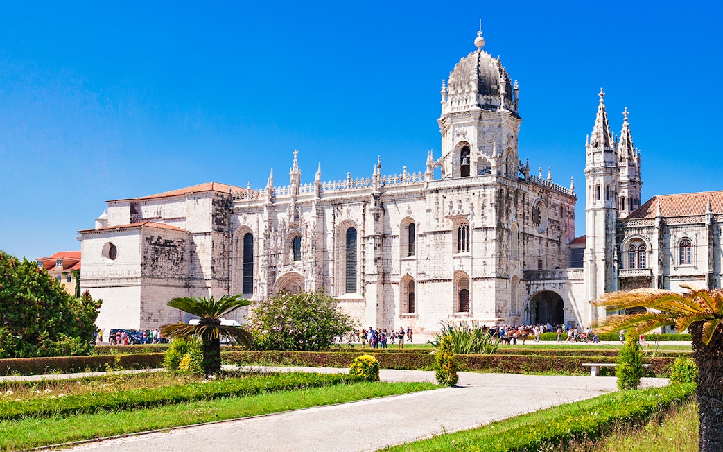 Jerónimos Monastery facade with gardens, Lisbon.