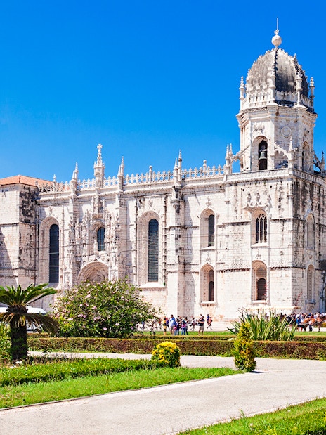 Jerónimos Monastery facade with gardens, Lisbon.