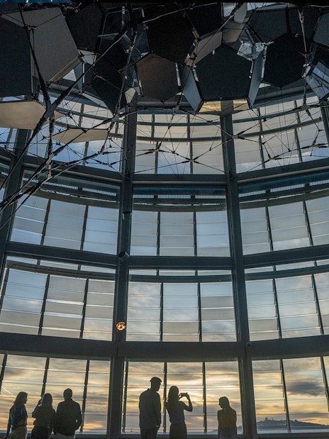 Visitors enjoying sunset views from Torre Glories Lookout in Barcelona.