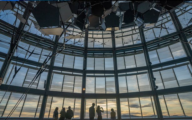 Visitors enjoying sunset views from Torre Glories Lookout in Barcelona.