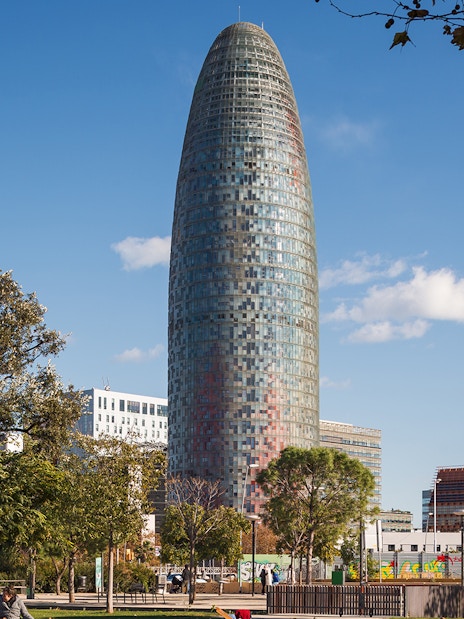 Glories Skyline Tower in Barcelona with surrounding park and trees.