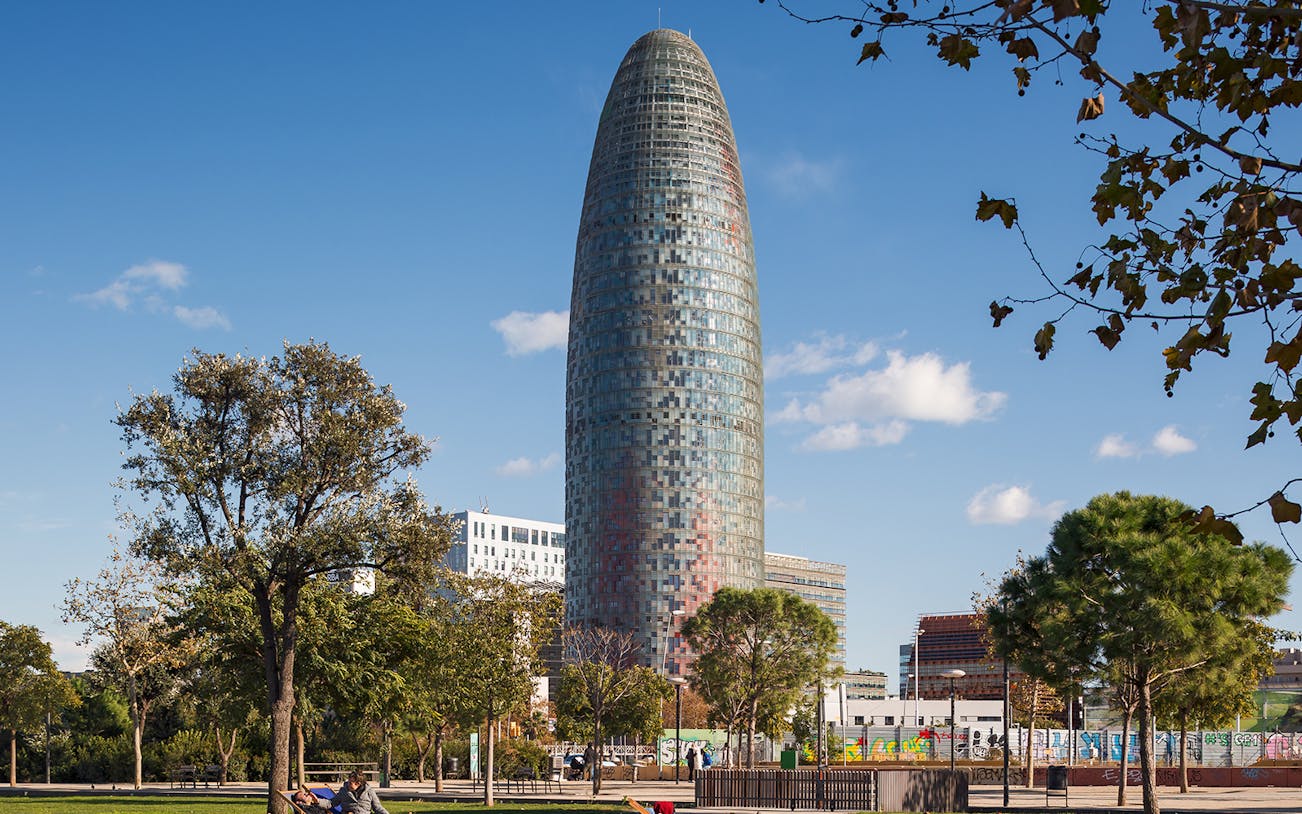 Glories Skyline Tower in Barcelona with surrounding park and trees.