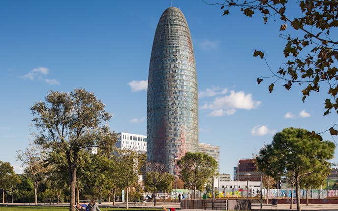 Glories Skyline Tower in Barcelona with surrounding park and trees.