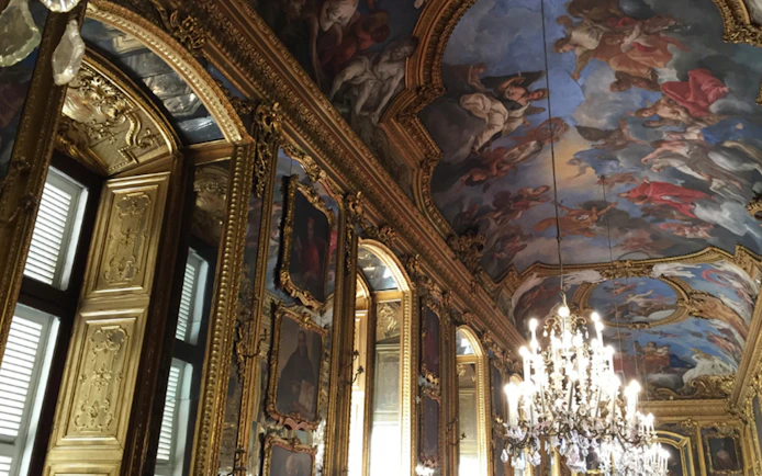 Ornate ceiling and chandeliers in the Royal Palace of Turin, Italy.