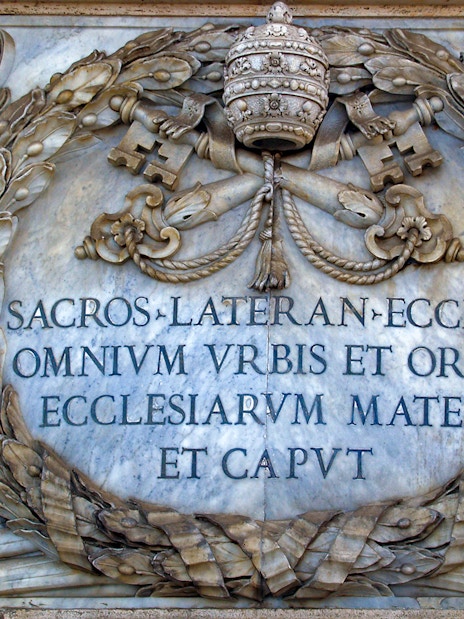 St. John Lateran inscription with papal symbols in Rome, Italy.