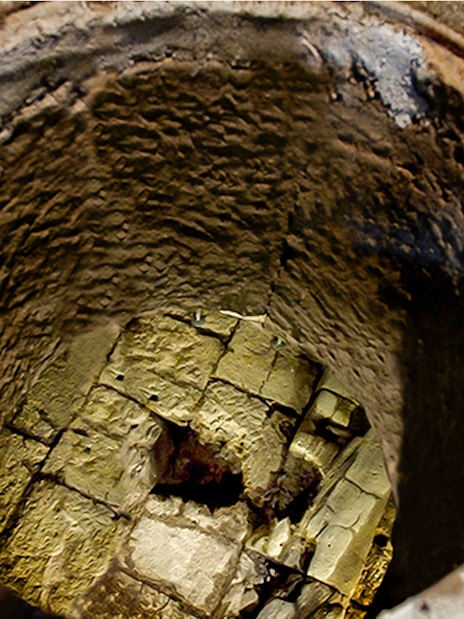Mamertine Prison ancient stone well entrance in Rome.