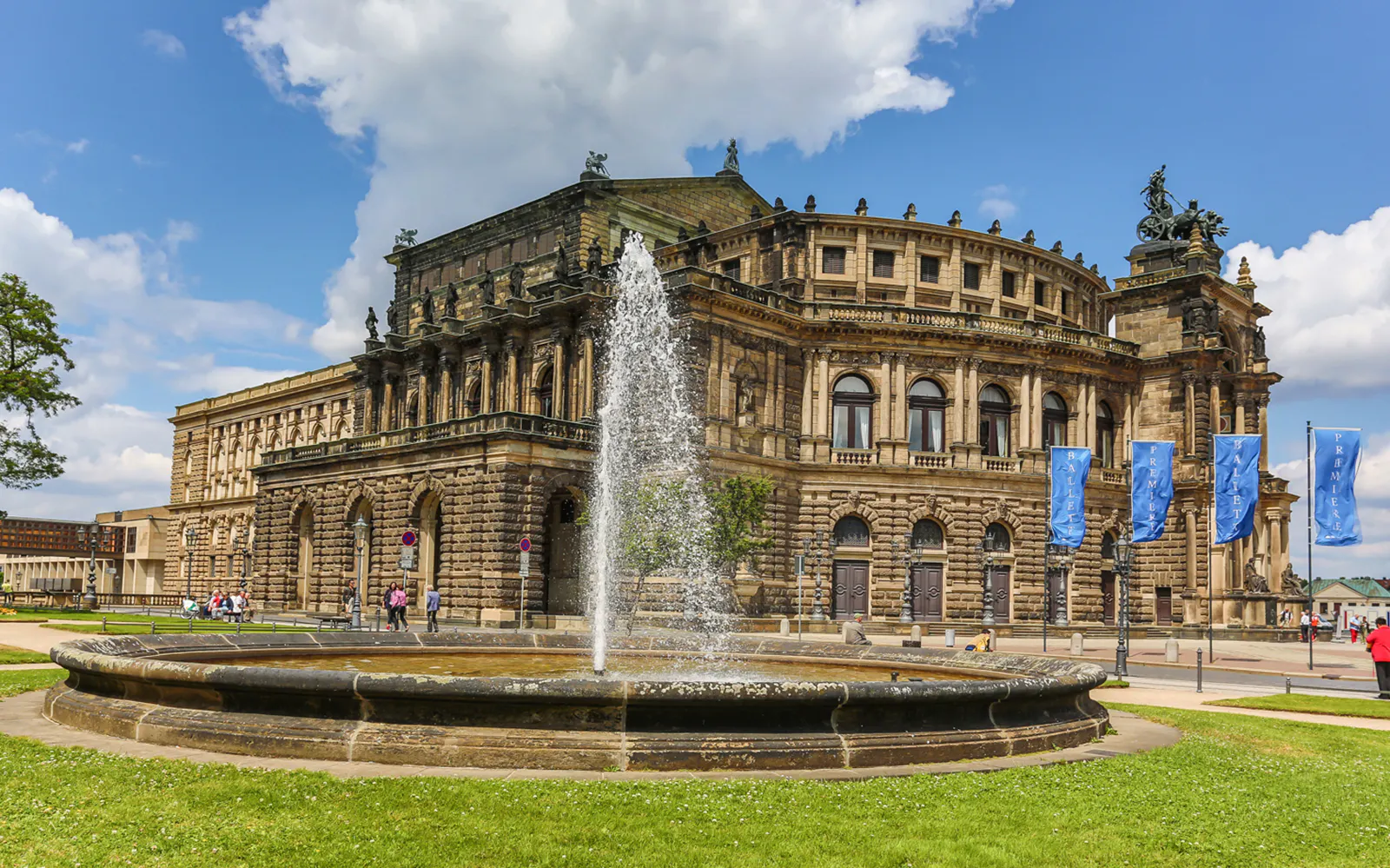 Semperoper opera house with fountain in Dresden, Germany, on a guided sightseeing tour.
