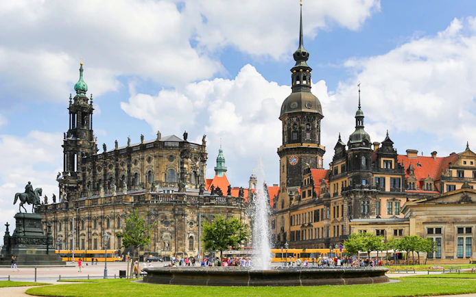 Dresden's historic city center with Frauenkirche and equestrian statue on a guided tour.