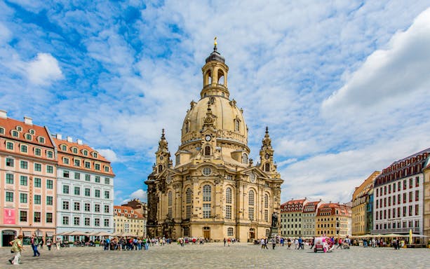 Frauenkirche Dresden with tourists on a guided sightseeing tour in Germany.