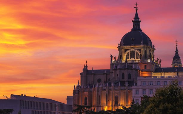 Almudena Cathedral at sunset in Madrid during a tour.