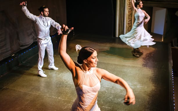 Flamenco dancers performing on stage during a sunset tour in Madrid.